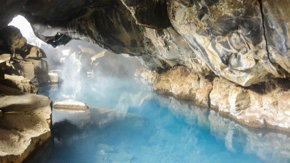 Steam rising from the thermal water in Grjótagjá cave